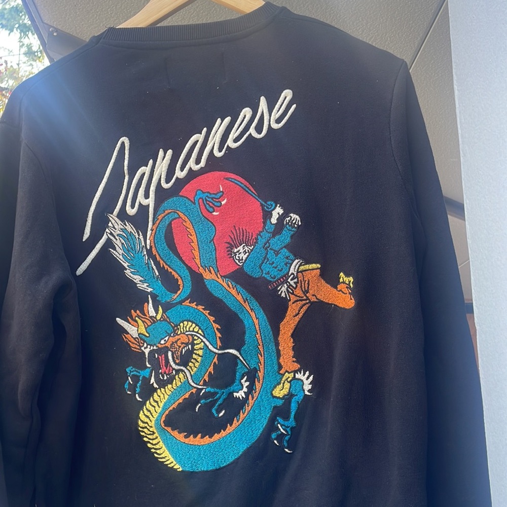 Embroidered crew neck sweater